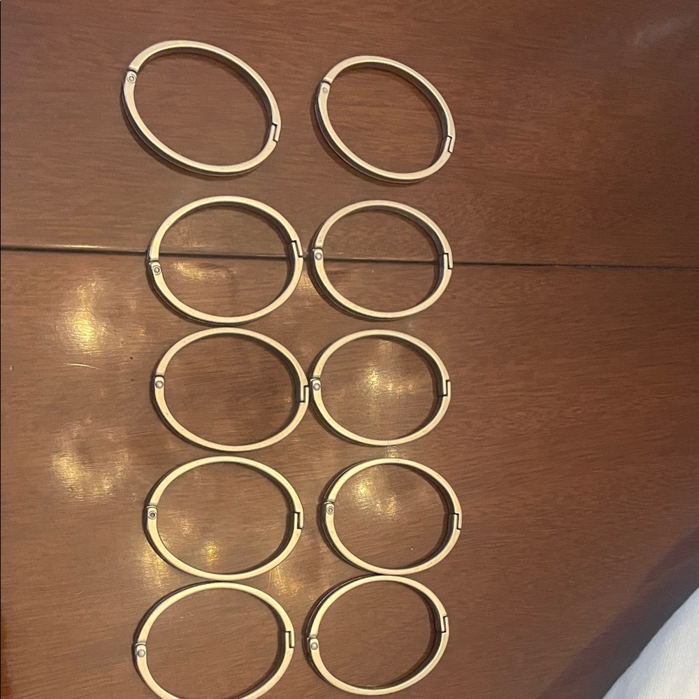 Set of silver shower curtain holders